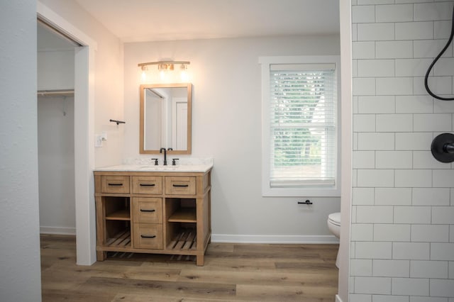 7591 Lake Ida Way NW, Alexandria, MN 56308 - bathroom featuring vanity, a tile shower, and plenty of natural light