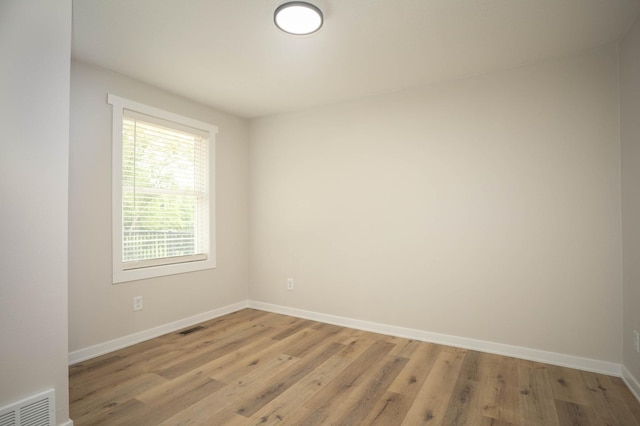 7591 Lake Ida Way NW, Alexandria, MN 56308 - unfurnished room featuring baseboards and light wood-style flooring