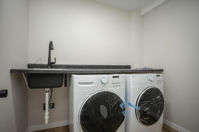 7591 Lake Ida Way NW, Alexandria, MN 56308 - laundry room featuring independent washer and dryer and wood finished floors