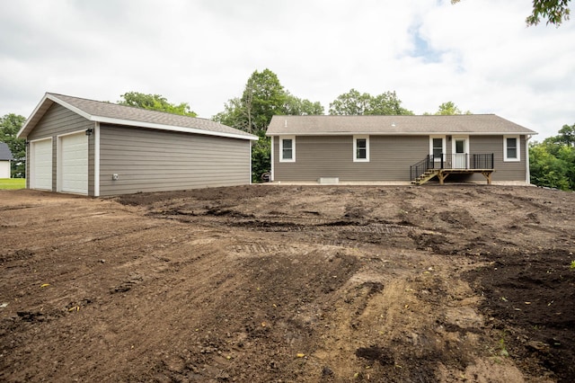 7591 Lake Ida Way NW, Alexandria, MN 56308 - back of house featuring a garage and an outdoor structure