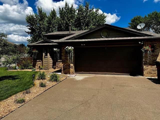 6314 112th Pl N, Champlin, MN 55316 - view of front facade with brick siding, a garage, driveway, and a front lawn