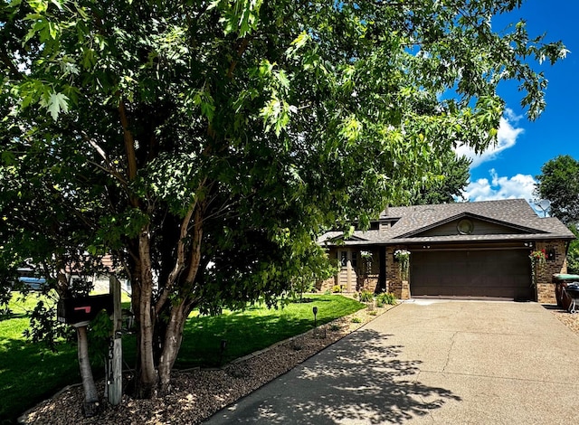 6314 112th Pl N, Champlin, MN 55316 - obstructed view of property with driveway, an attached garage, a front lawn, brick siding, and roof with shingles