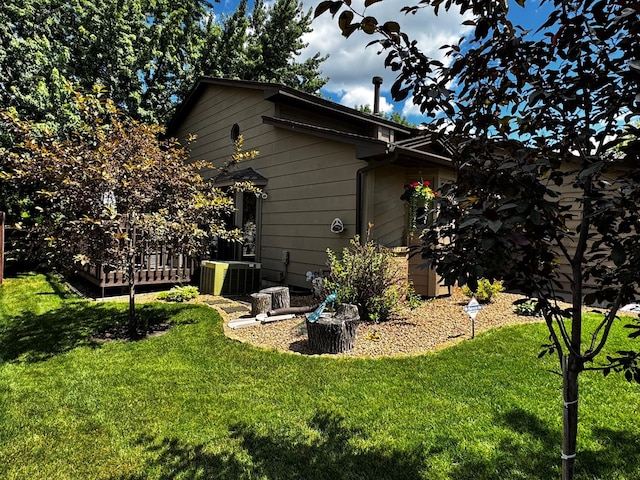 6314 112th Pl N, Champlin, MN 55316 - rear view of house with a lawn and a deck