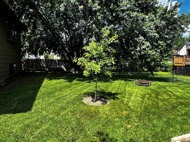 6314 112th Pl N, Champlin, MN 55316 - fenced backyard featuring an outdoor fire pit