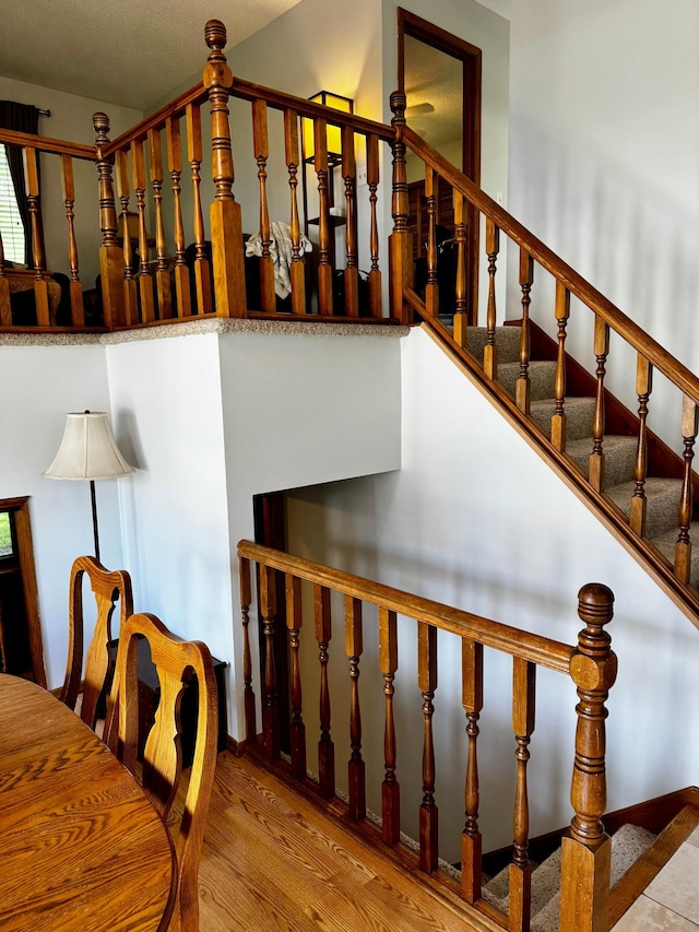 6314 112th Pl N, Champlin, MN 55316 - stairway featuring wood finished floors