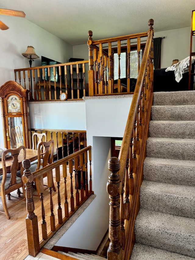 6314 112th Pl N, Champlin, MN 55316 - staircase with ceiling fan and wood finished floors