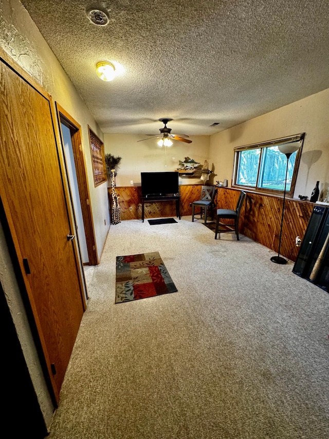 6314 112th Pl N, Champlin, MN 55316 - living room with carpet flooring, ceiling fan, and a textured ceiling