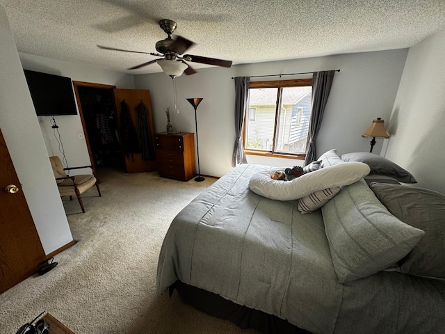 6314 112th Pl N, Champlin, MN 55316 - bedroom featuring carpet, a textured ceiling, and ceiling fan