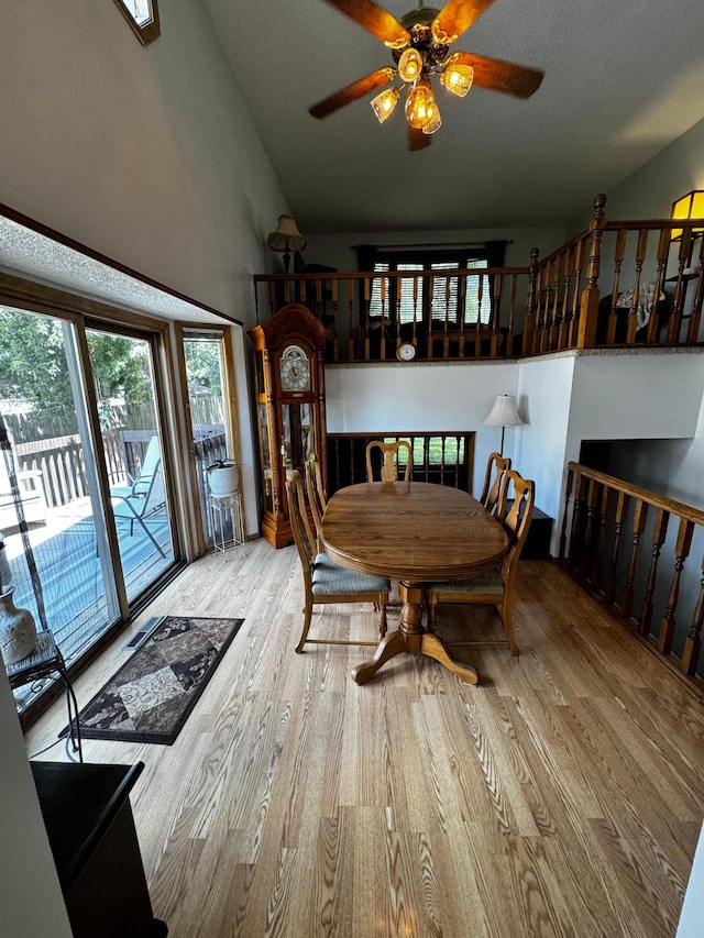 6314 112th Pl N, Champlin, MN 55316 - dining area with wood finished floors, healthy amount of natural light, ceiling fan, and high vaulted ceiling