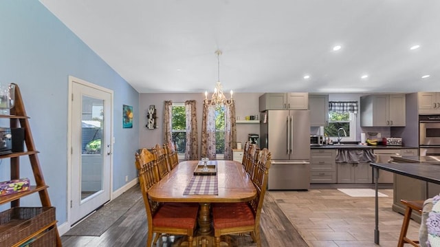 19421 708th Ave, Dassel, MN 55325 - dining space featuring plenty of natural light, a chandelier, recessed lighting, and light wood-style floors