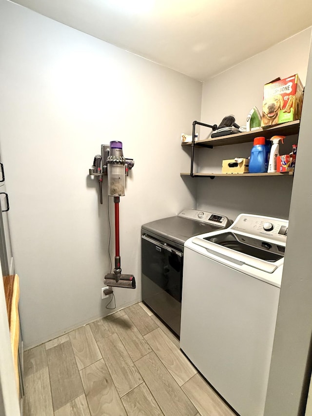 19421 708th Ave, Dassel, MN 55325 - washroom featuring washer and clothes dryer and light wood-style floors