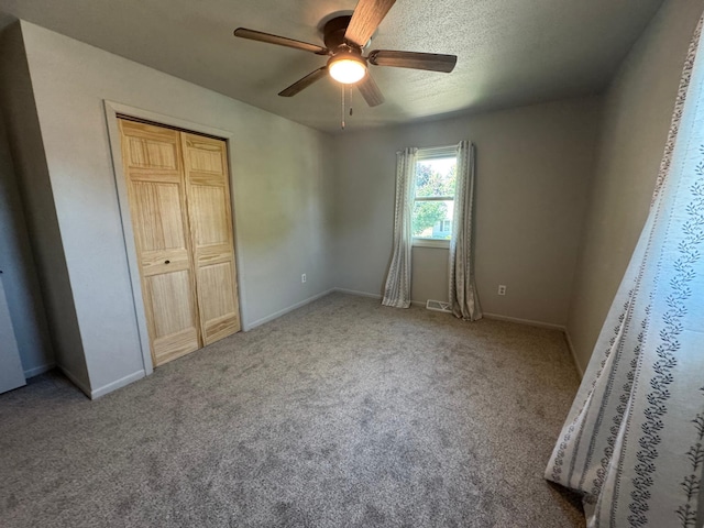 815 6th St N, New Ulm, MN 56073 - unfurnished bedroom with carpet, a closet, and a ceiling fan