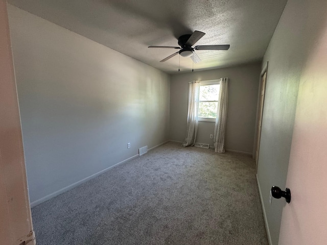 815 6th St N, New Ulm, MN 56073 - spare room with ceiling fan, carpet floors, and a textured ceiling