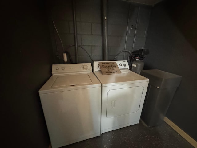 815 6th St N, New Ulm, MN 56073 - laundry room with washing machine and dryer and concrete block wall