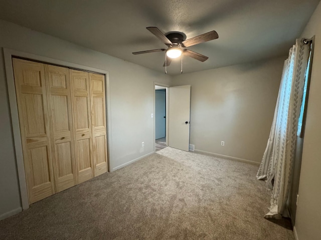 815 6th St N, New Ulm, MN 56073 - unfurnished bedroom with carpet, a closet, and ceiling fan