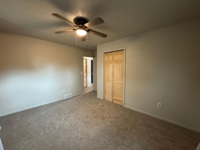 815 6th St N, New Ulm, MN 56073 - unfurnished bedroom featuring carpet flooring, a closet, and ceiling fan