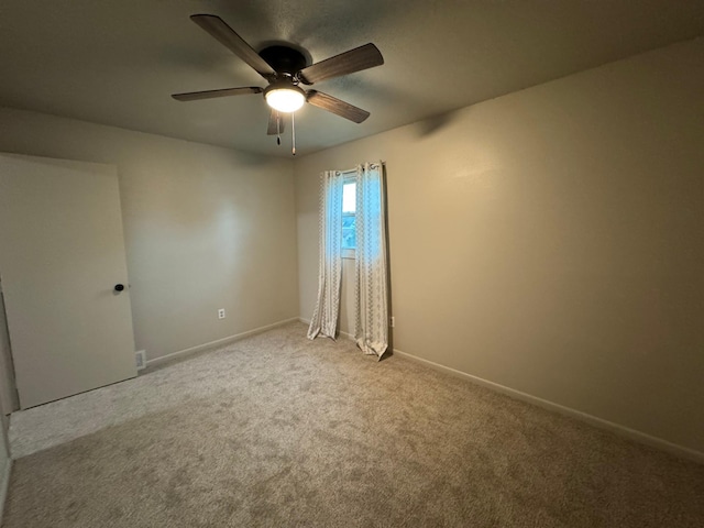 815 6th St N, New Ulm, MN 56073 - carpeted empty room with ceiling fan and baseboards