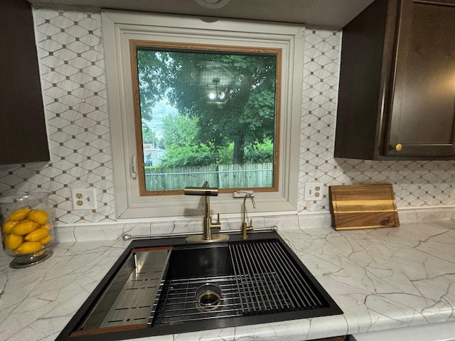 815 6th St N, New Ulm, MN 56073 - kitchen featuring backsplash and dark brown cabinetry