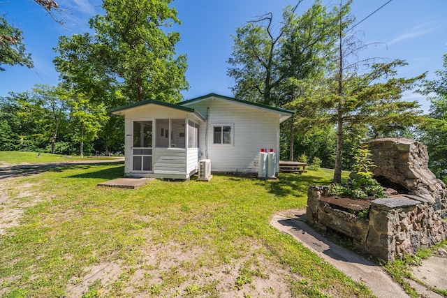 23546 Warbler Way Unit C7, Detroit Lakes, MN 56501 - back of property featuring a sunroom and a lawn