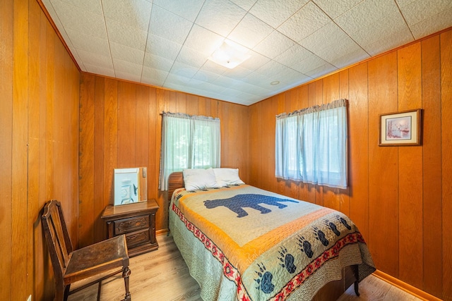 23546 Warbler Way Unit C7, Detroit Lakes, MN 56501 - bedroom with wood finished floors and wooden walls