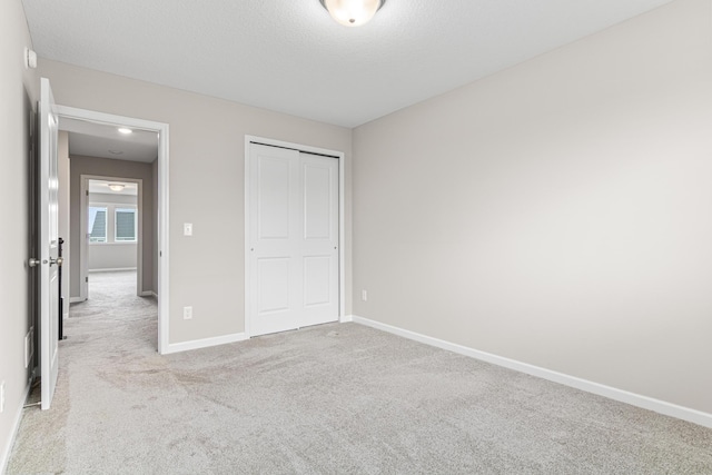 10070 32nd St NE, Saint Michael, MN 55376 - unfurnished bedroom with carpet, a closet, and a textured ceiling