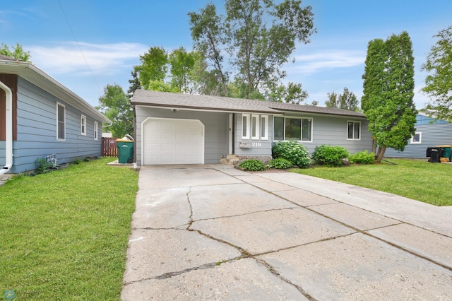219 10th Ave E, Fargo, ND 58078 - ranch-style house featuring a garage, driveway, and a front yard