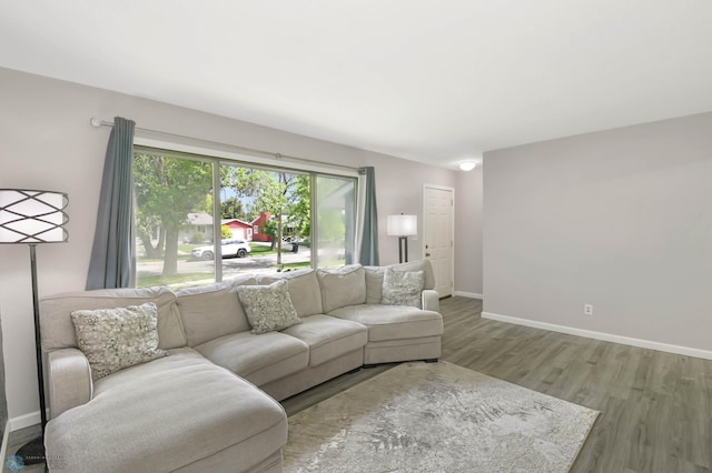 219 10th Ave E, Fargo, ND 58078 - living room featuring wood finished floors and baseboards