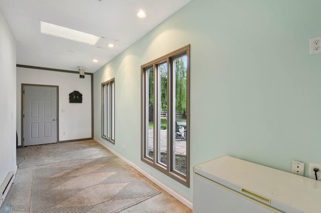 219 10th Ave E, Fargo, ND 58078 - entryway with baseboard heating, recessed lighting, and concrete flooring