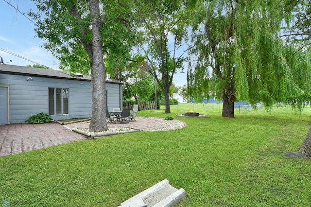 219 10th Ave E, Fargo, ND 58078 - view of yard with a patio and a fire pit
