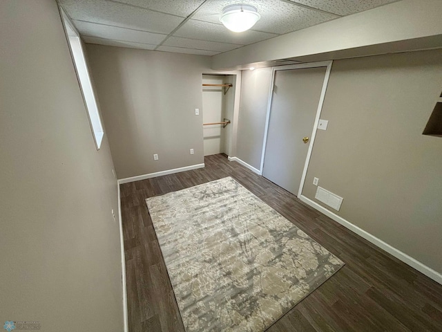 219 10th Ave E, Fargo, ND 58078 - unfurnished bedroom with wood finished floors, a drop ceiling, and a closet