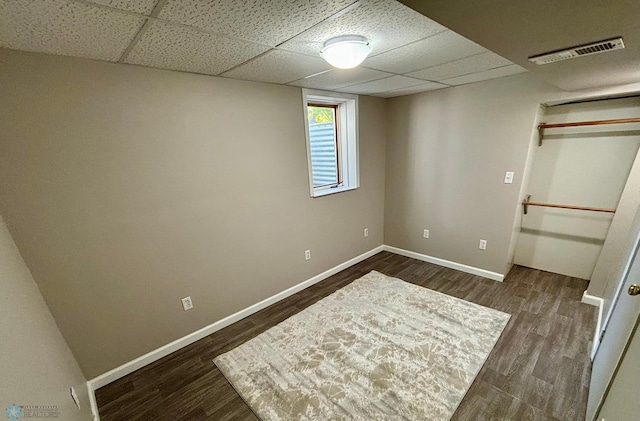 219 10th Ave E, Fargo, ND 58078 - unfurnished bedroom with dark wood-style floors and a paneled ceiling