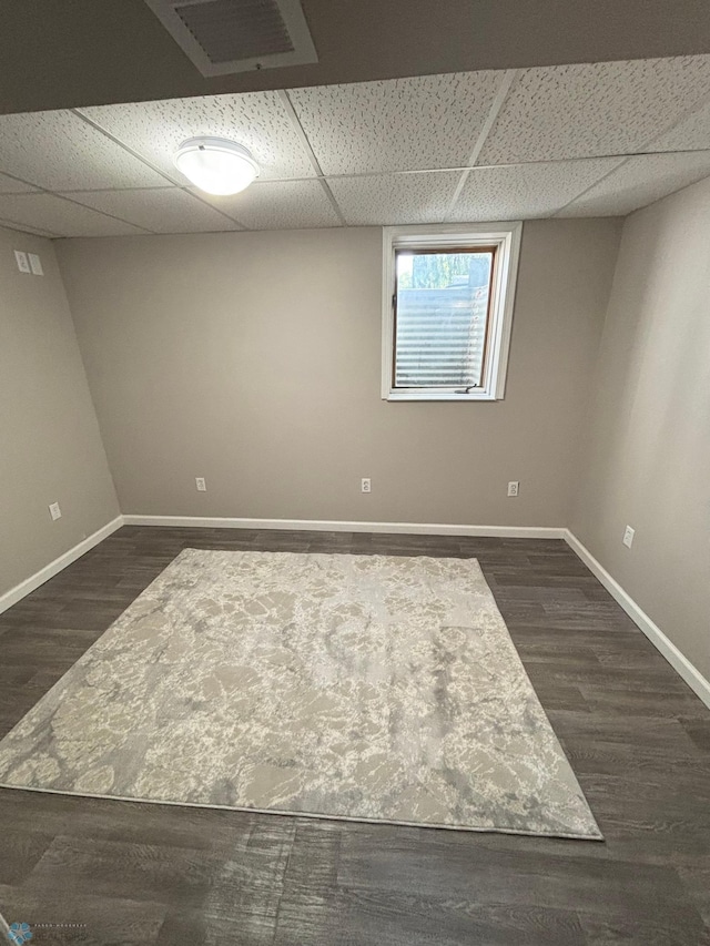 219 10th Ave E, Fargo, ND 58078 - below grade area with a drop ceiling and dark wood-style flooring
