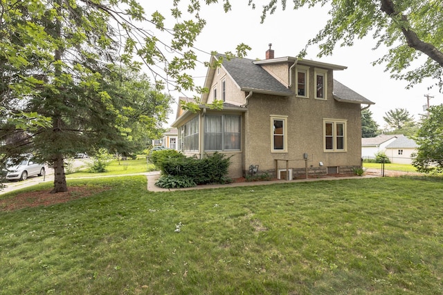 3331 34th Ave S, Minneapolis, MN 55406 - view of property exterior featuring a chimney, stucco siding, and roof with shingles