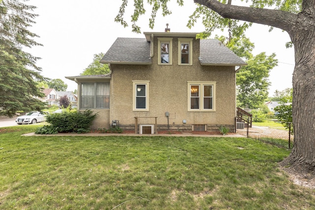 3331 34th Ave S, Minneapolis, MN 55406 - rear view of property featuring stucco siding, a shingled roof, and a chimney