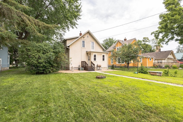 3331 34th Ave S, Minneapolis, MN 55406 - rear view of property with stucco siding and a chimney