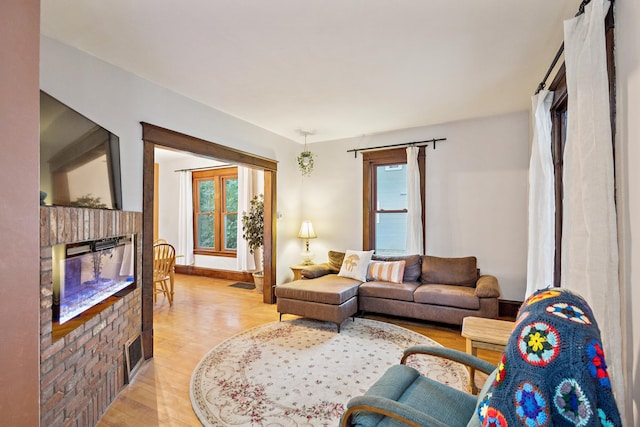 3331 34th Ave S, Minneapolis, MN 55406 - living area with a fireplace, healthy amount of natural light, and light wood-style floors