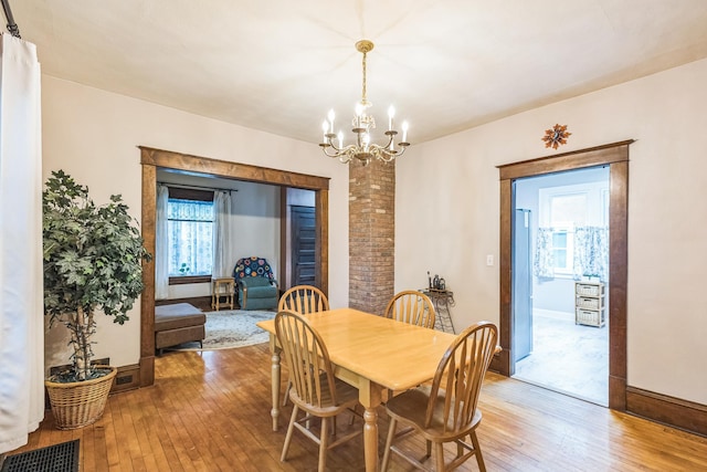 3331 34th Ave S, Minneapolis, MN 55406 - dining room featuring light wood-style flooring and a chandelier