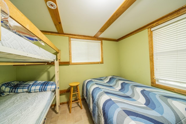 23546 Warbler Way Unit C1, Detroit Lakes, MN 56501 - bedroom featuring baseboards and beam ceiling