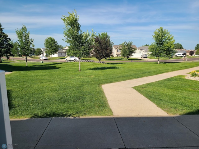 4394 46th Ave S Unit B, Fargo, ND 58104 - surrounding community with a lawn and a residential view