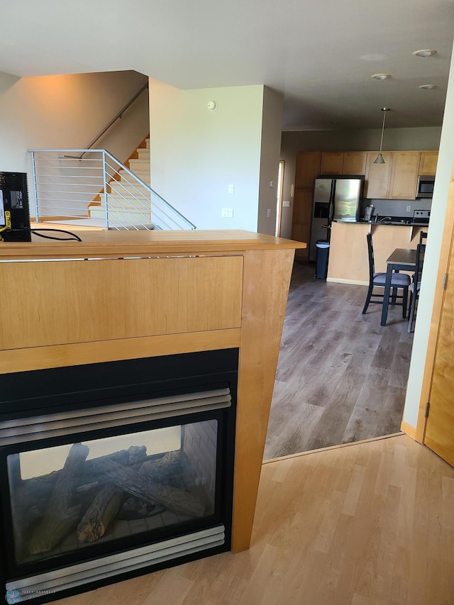 4394 46th Ave S Unit B, Fargo, ND 58104 - detailed view of appliances with stainless steel finishes and wood finished floors