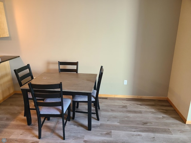 4394 46th Ave S Unit B, Fargo, ND 58104 - dining room featuring wood finished floors and baseboards