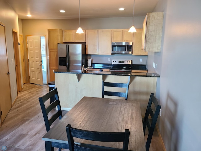 4394 46th Ave S Unit B, Fargo, ND 58104 - kitchen with stainless steel appliances, light brown cabinets, light wood-type flooring, recessed lighting, and pendant lighting