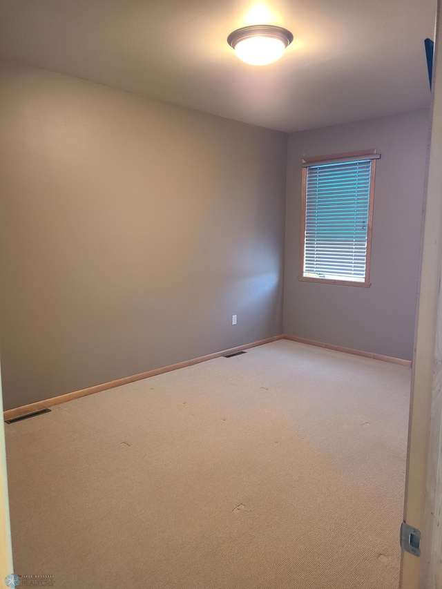 4394 46th Ave S Unit B, Fargo, ND 58104 - empty room with carpet flooring and baseboards