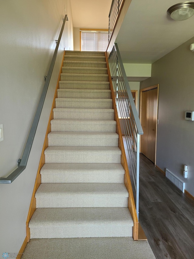 4394 46th Ave S Unit B, Fargo, ND 58104 - staircase featuring wood finished floors and baseboards