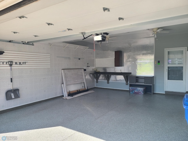 4394 46th Ave S Unit B, Fargo, ND 58104 - garage featuring a garage door opener and a ceiling fan