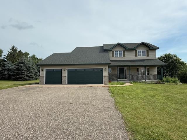1355 Butterfly Ln, Spring Lake Twp, MN 55352 - view of front facade with a porch, asphalt driveway, a front yard, and an attached garage