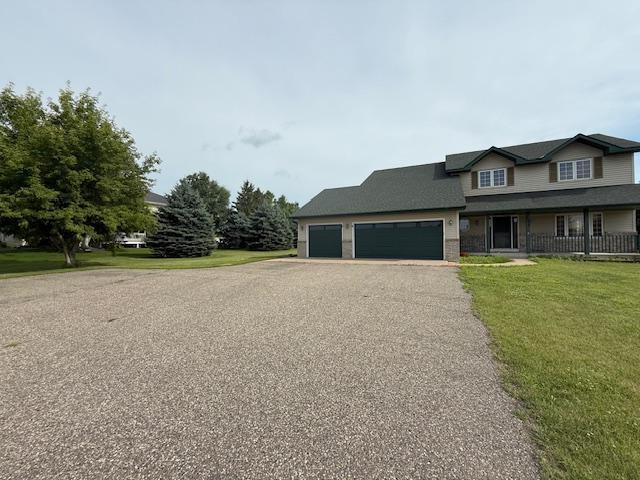 1355 Butterfly Ln, Spring Lake Twp, MN 55352 - view of front of house featuring a front yard, a garage, and asphalt driveway