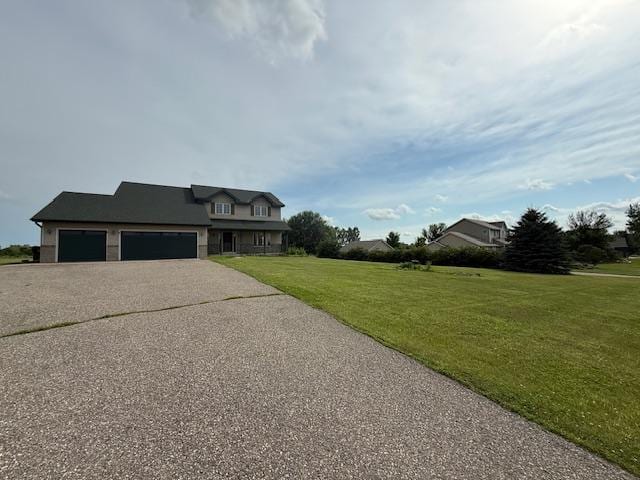 1355 Butterfly Ln, Spring Lake Twp, MN 55352 - view of front of property with a garage, asphalt driveway, and a front lawn
