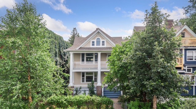 704-706 Holly Ave, Saint Paul, MN 55104 - view of front of property featuring covered porch, a balcony, and a shingled roof
