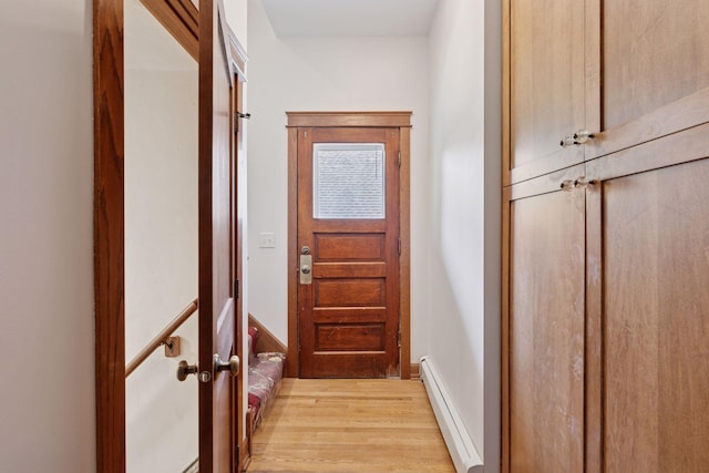 704-706 Holly Ave, Saint Paul, MN 55104 - doorway with baseboard heating and light wood-type flooring